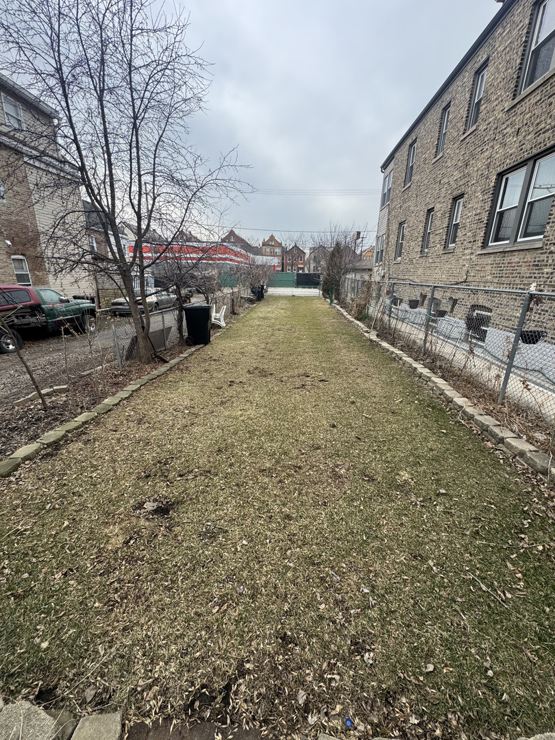 2640 South Troy Street Chicago, IL 60623 - Photo 2 of 5 a view of a street with houses
