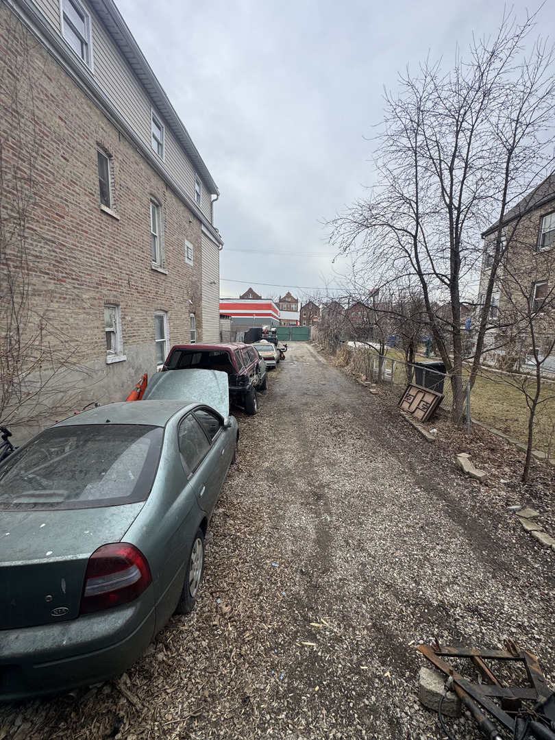 2640 South Troy Street Chicago, IL 60623 - Photo 5 of 5 a view of a backyard with table and chairs and a barbeque