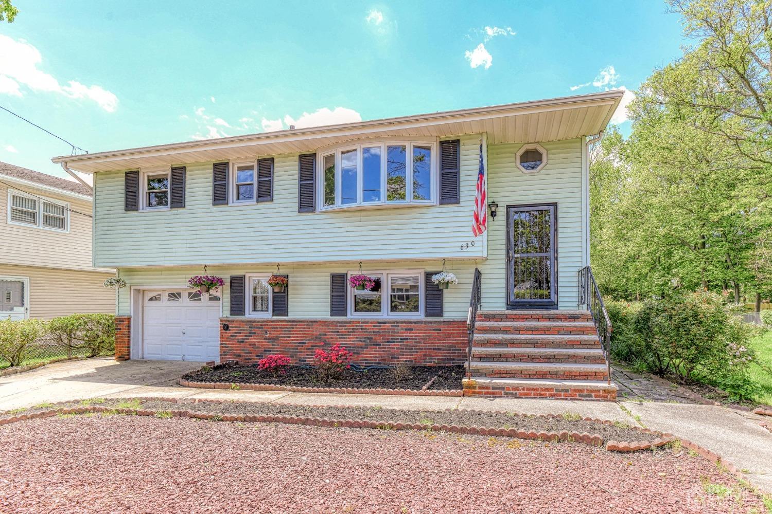 630 Dewey Road North Brunswick, NJ 08902 - Photo 26 of 28 a front view of a house with a yard