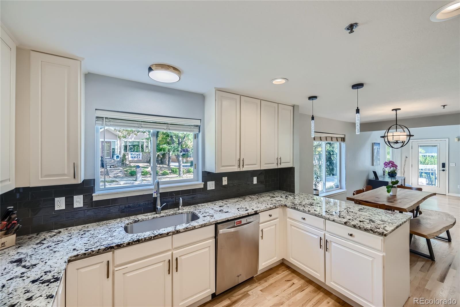 4766 Franklin Drive Boulder, CO 80301 - Photo 8 of 26 a kitchen with granite countertop sink stove and cabinets