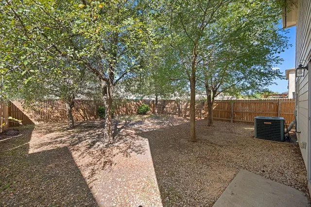 a view of a backyard with trees