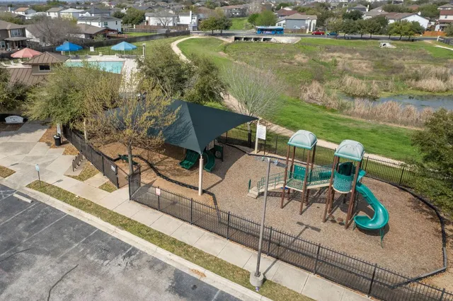swimming pool with chairs and table of ocean view