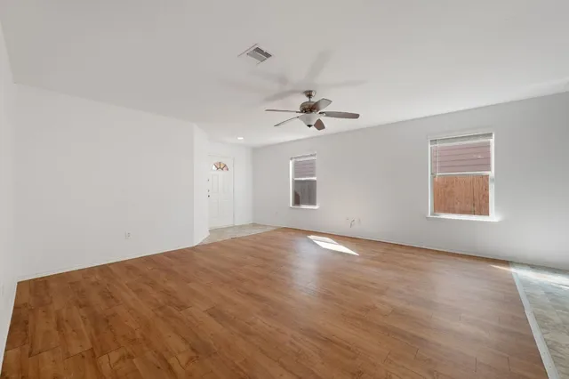 a view of an empty room with a window