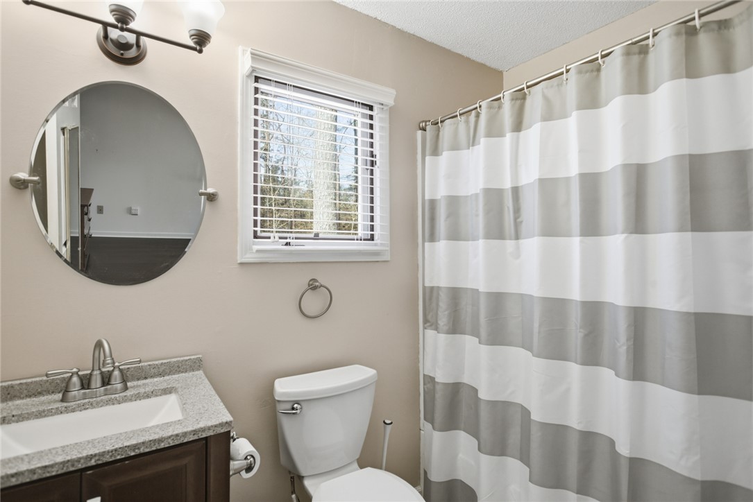 308 Wildwood Road Walhalla, SC 29691 - Photo 14 of 23 This bright bathroom features ample light and a modern vanity.