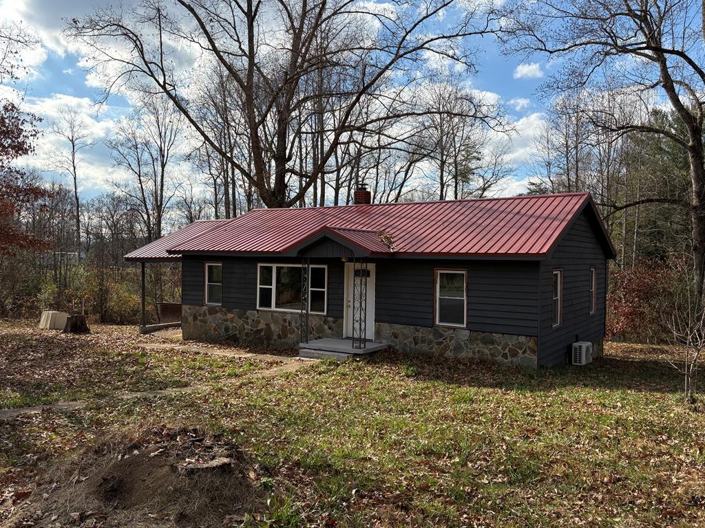 62 Pleasant Hill Road Murphy, NC 28906 - Photo 1 of 28 a front view of a house with garden