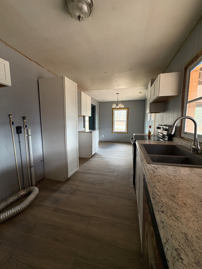 62 Pleasant Hill Road Murphy, NC 28906 - Photo 11 of 28 a kitchen with stainless steel appliances granite countertop a refrigerator a sink a stove and a refrigerator with wooden floor