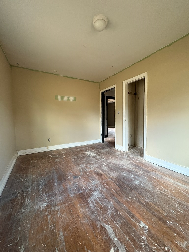 62 Pleasant Hill Road Murphy, NC 28906 - Photo 22 of 28 a view of an empty room with window and wooden floor