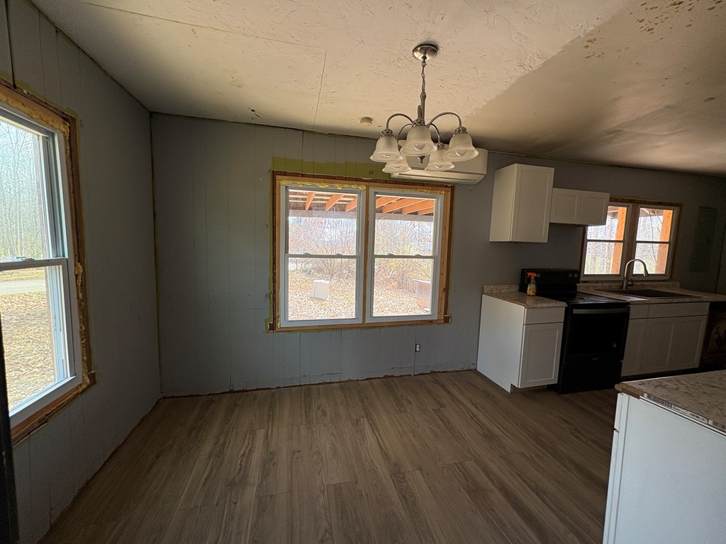 62 Pleasant Hill Road Murphy, NC 28906 - Photo 5 of 28 a view of a kitchen with a sink wooden floor and a window
