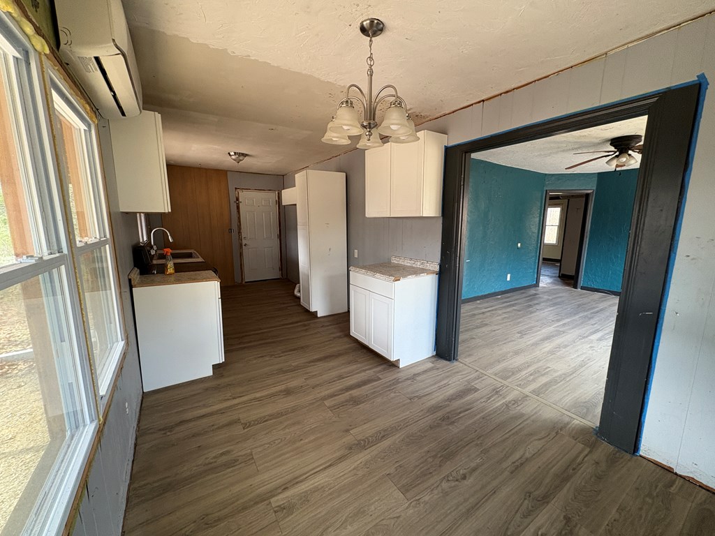 62 Pleasant Hill Road Murphy, NC 28906 - Photo 6 of 28 a view of a kitchen with a sink refrigerator and wooden floor