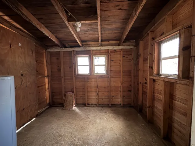 a view of empty room with windows