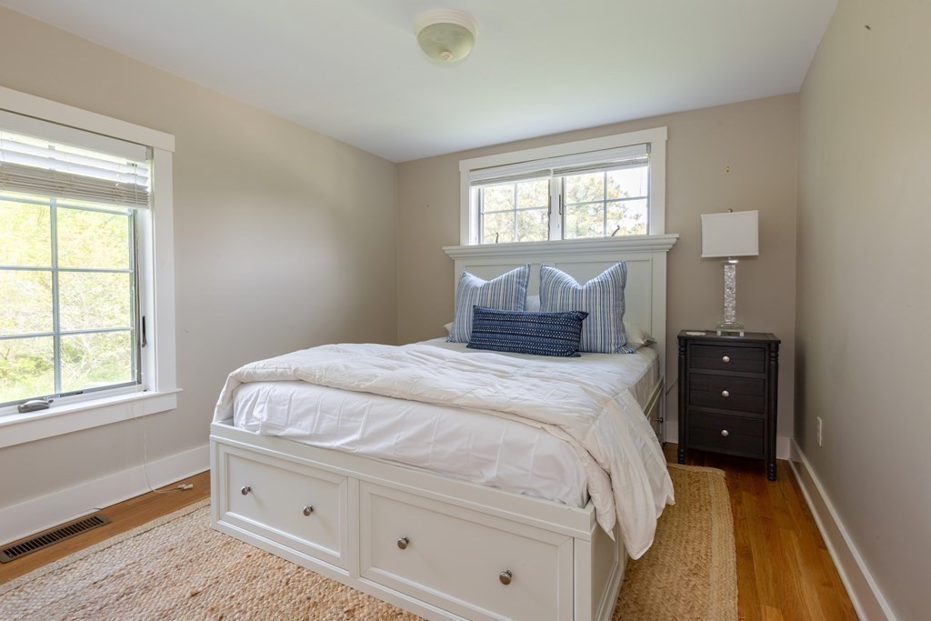 12 A Pond View Drive, Unit COTTAGE Nantucket, MA 02554 - Photo 12 of 14 a bedroom with a bed and a window
