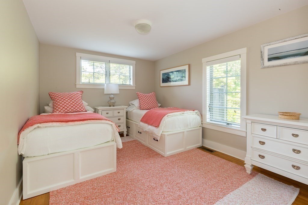 12 A Pond View Drive, Unit COTTAGE Nantucket, MA 02554 - Photo 13 of 14 a bedroom with two beds and a dresser