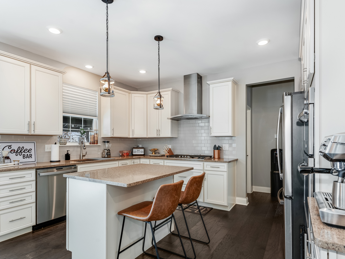 707 Long Ridge Trail Minooka, IL 60447 - Photo 11 of 39 a kitchen with stainless steel appliances granite countertop a sink a stove a refrigerator and island with wooden floor