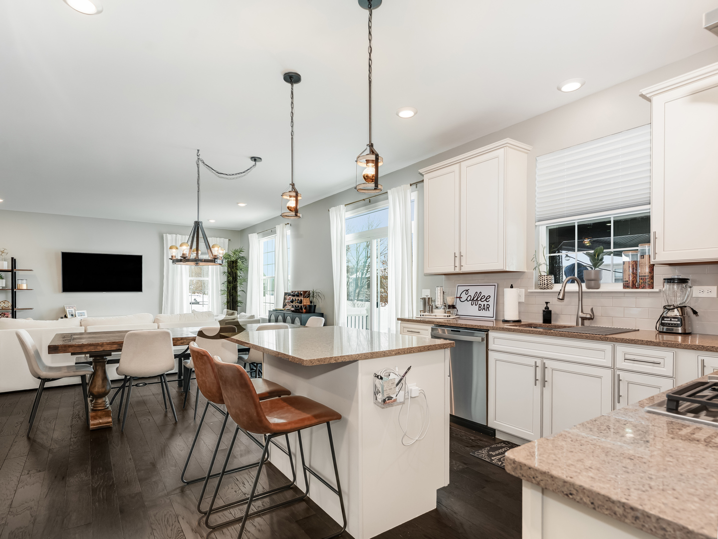 707 Long Ridge Trail Minooka, IL 60447 - Photo 12 of 39 a kitchen with stainless steel appliances kitchen island granite countertop a sink and cabinets