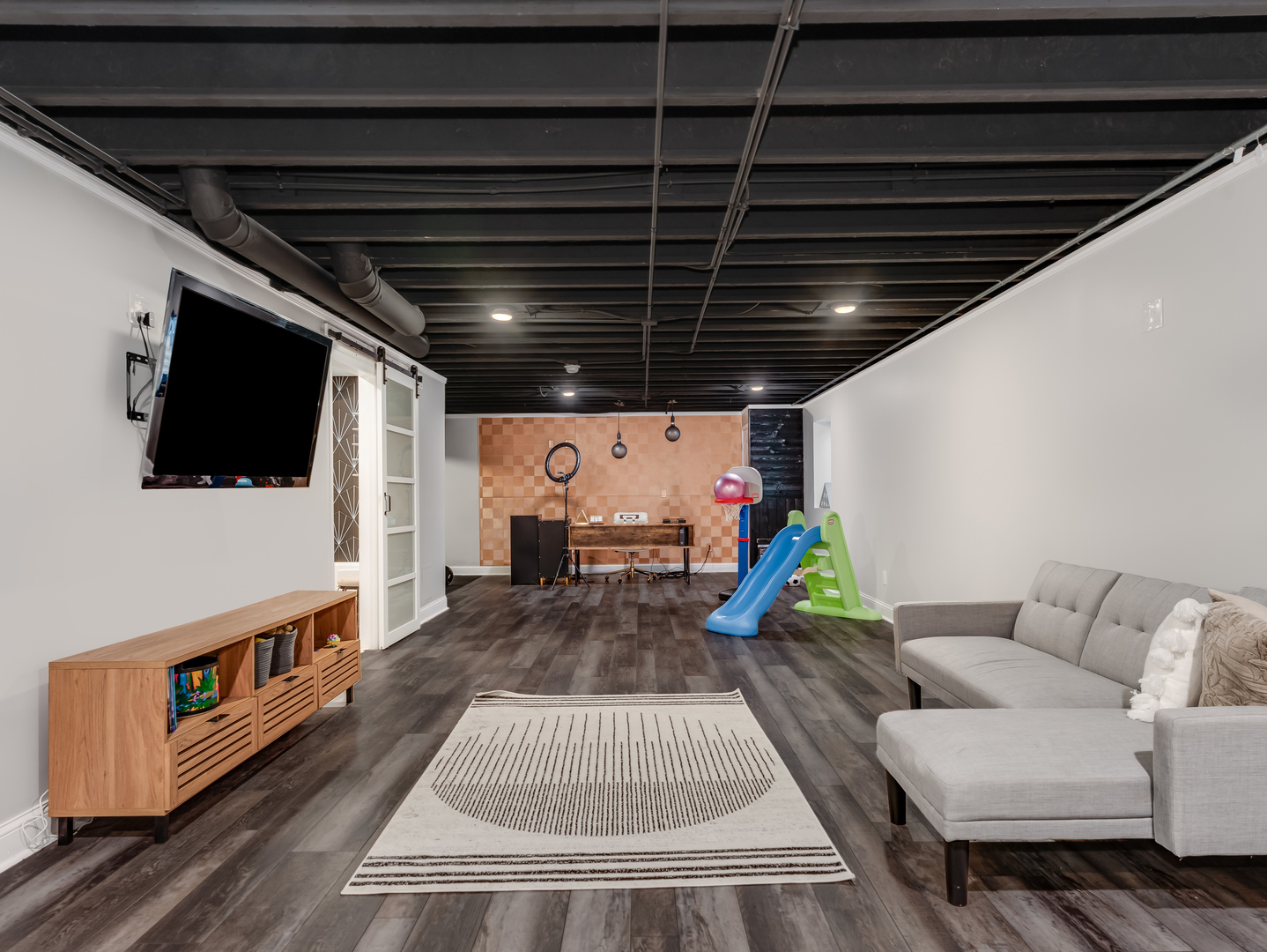 707 Long Ridge Trail Minooka, IL 60447 - Photo 31 of 39 a living room with furniture and a flat screen tv