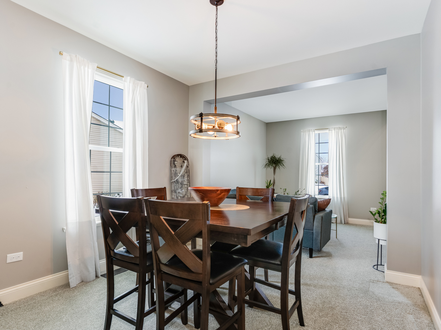 707 Long Ridge Trail Minooka, IL 60447 - Photo 7 of 39 a view of a dining room with furniture window and wooden floor