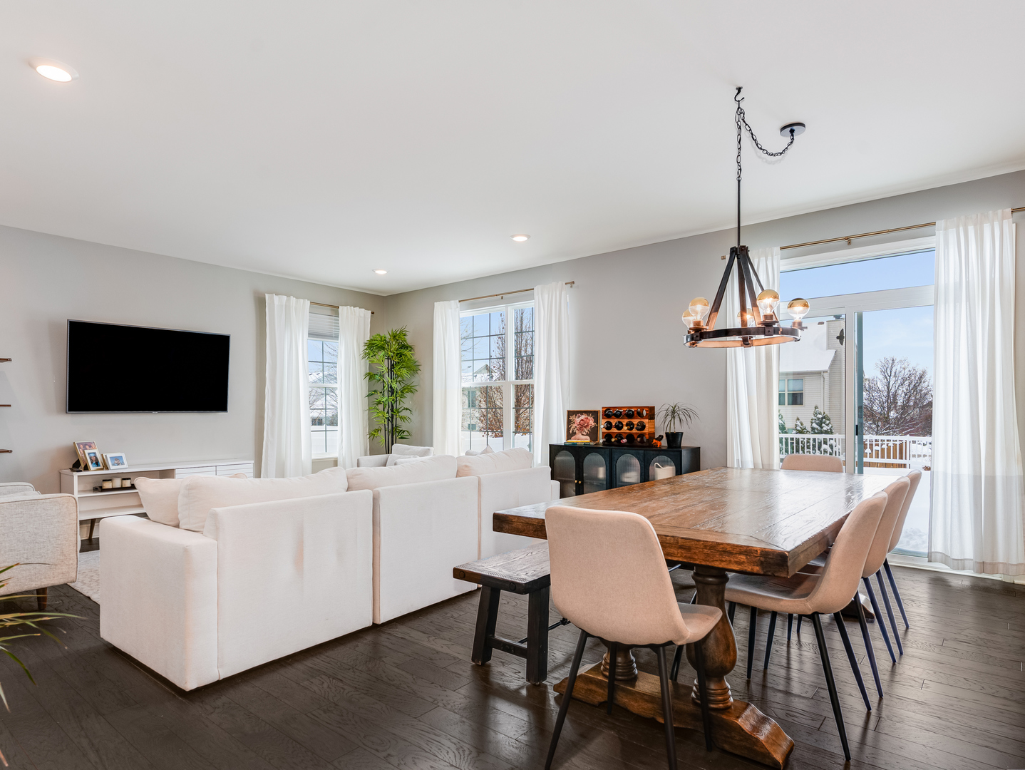 707 Long Ridge Trail Minooka, IL 60447 - Photo 9 of 39 a dining room with furniture a chandelier and wooden floor