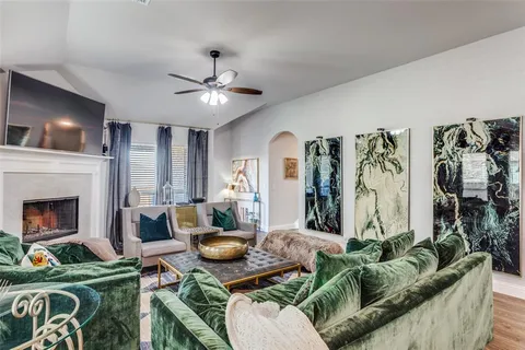 a living room with furniture and a fireplace