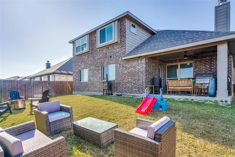 a backyard of a house with seating space