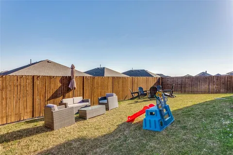 a view of a park with furniture