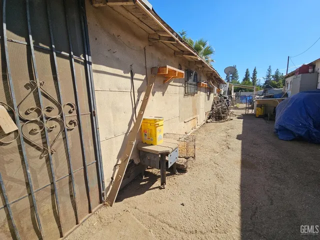 a swimming pool with outdoor seating and yard