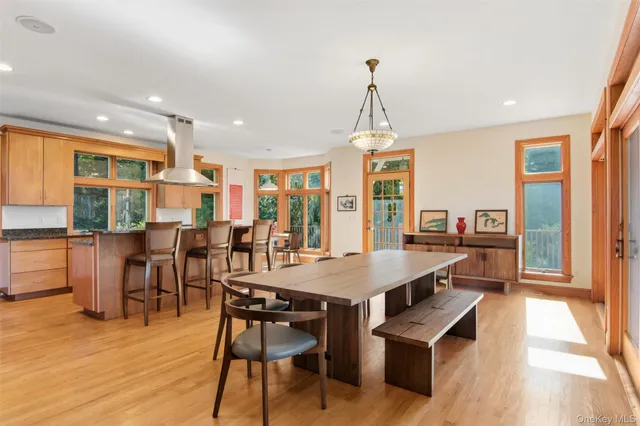 a view of a dining room with furniture window and wooden floor