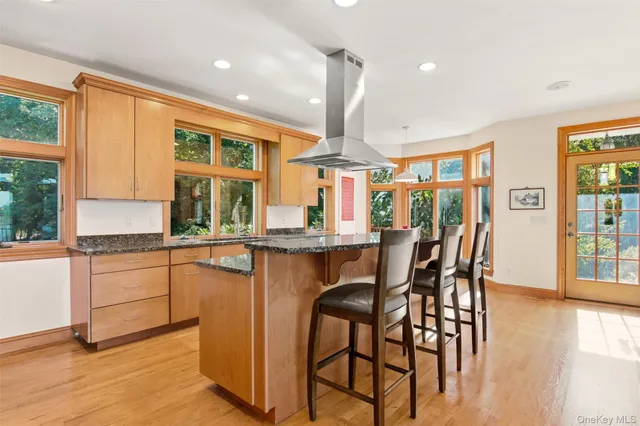 a kitchen with sink and large window