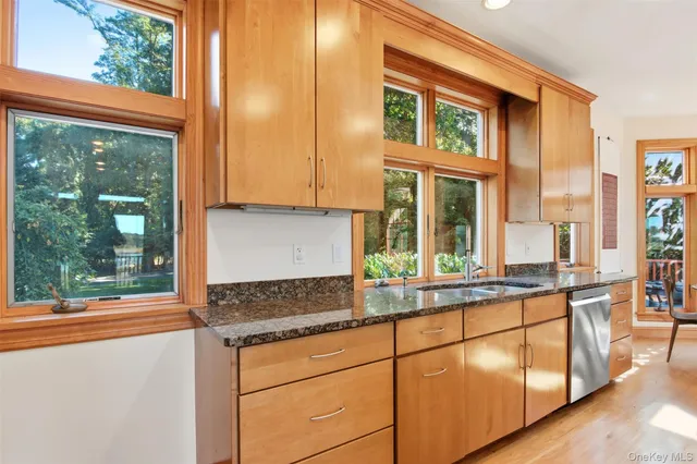 a kitchen with stainless steel appliances granite countertop a stove and a center island