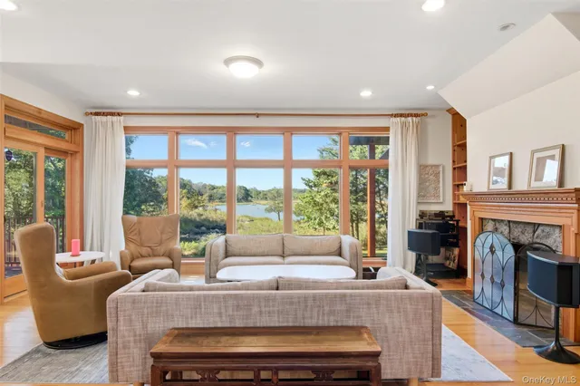 a view of living room with furniture and floor to ceiling window