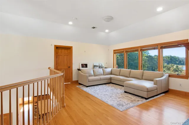 a balcony with trees in the background