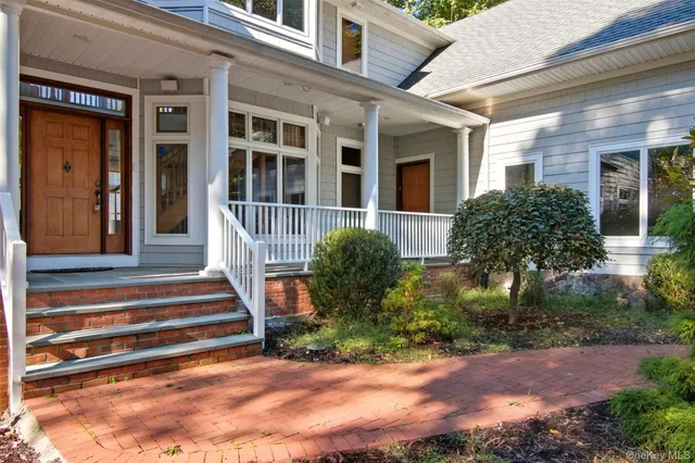 a balcony with wooden floor and outdoor space