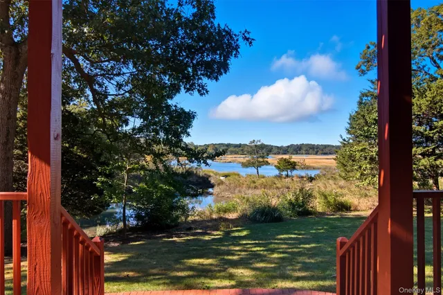 a view of a balcony with wooden floor
