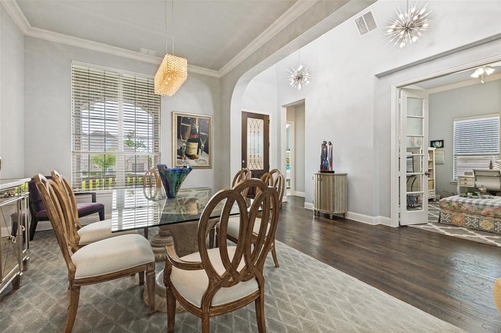506 Life Spring Drive Rockwall, TX 75087 - Photo 5 of 36 a view of a dining room with furniture and wooden floor