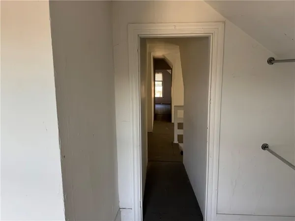 a view of a bathroom from a hallway