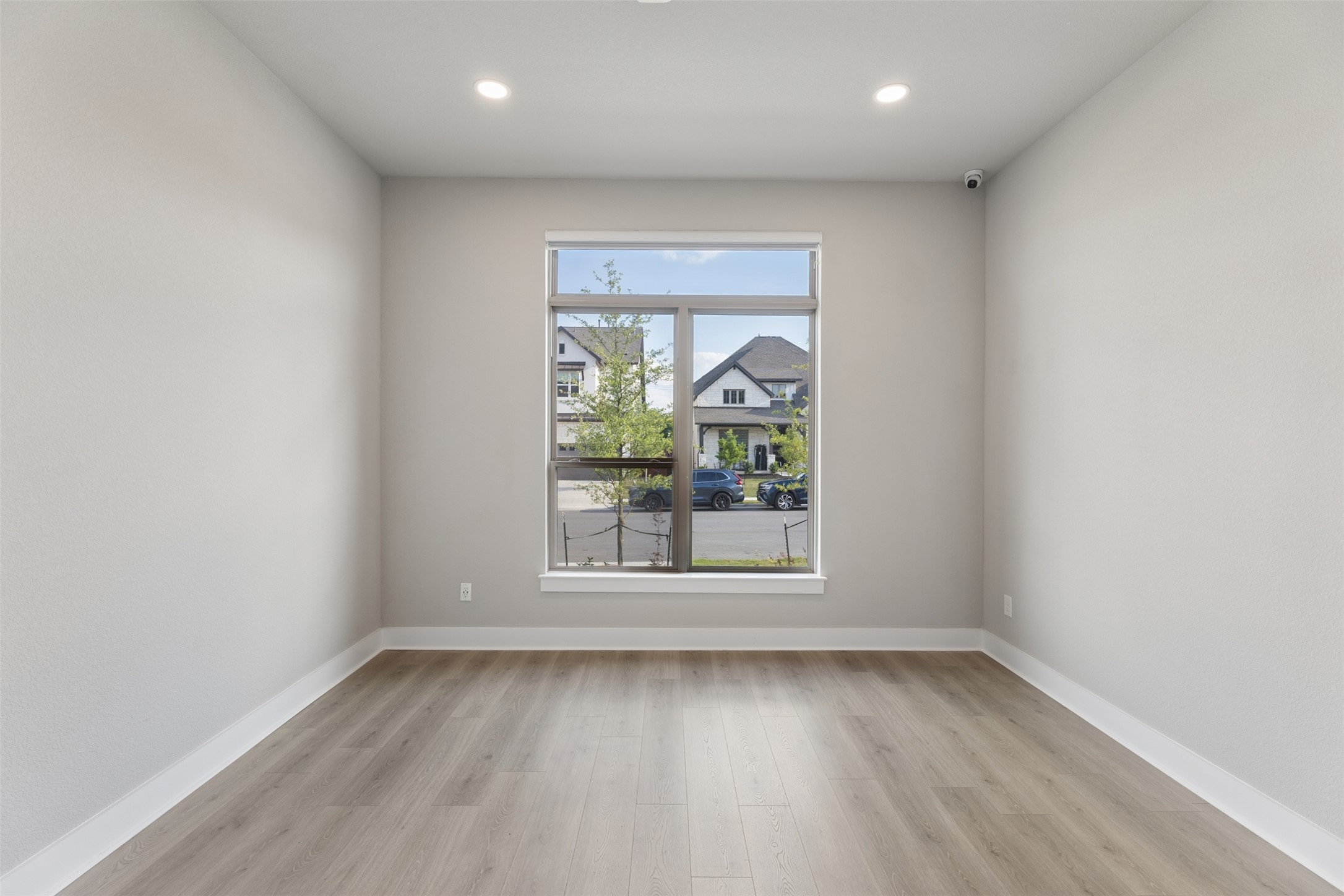 1508 Cardinal Lane Round Rock, TX 78681 - Photo 13 of 35 Empty room featuring light wood-style floors and recessed lighting