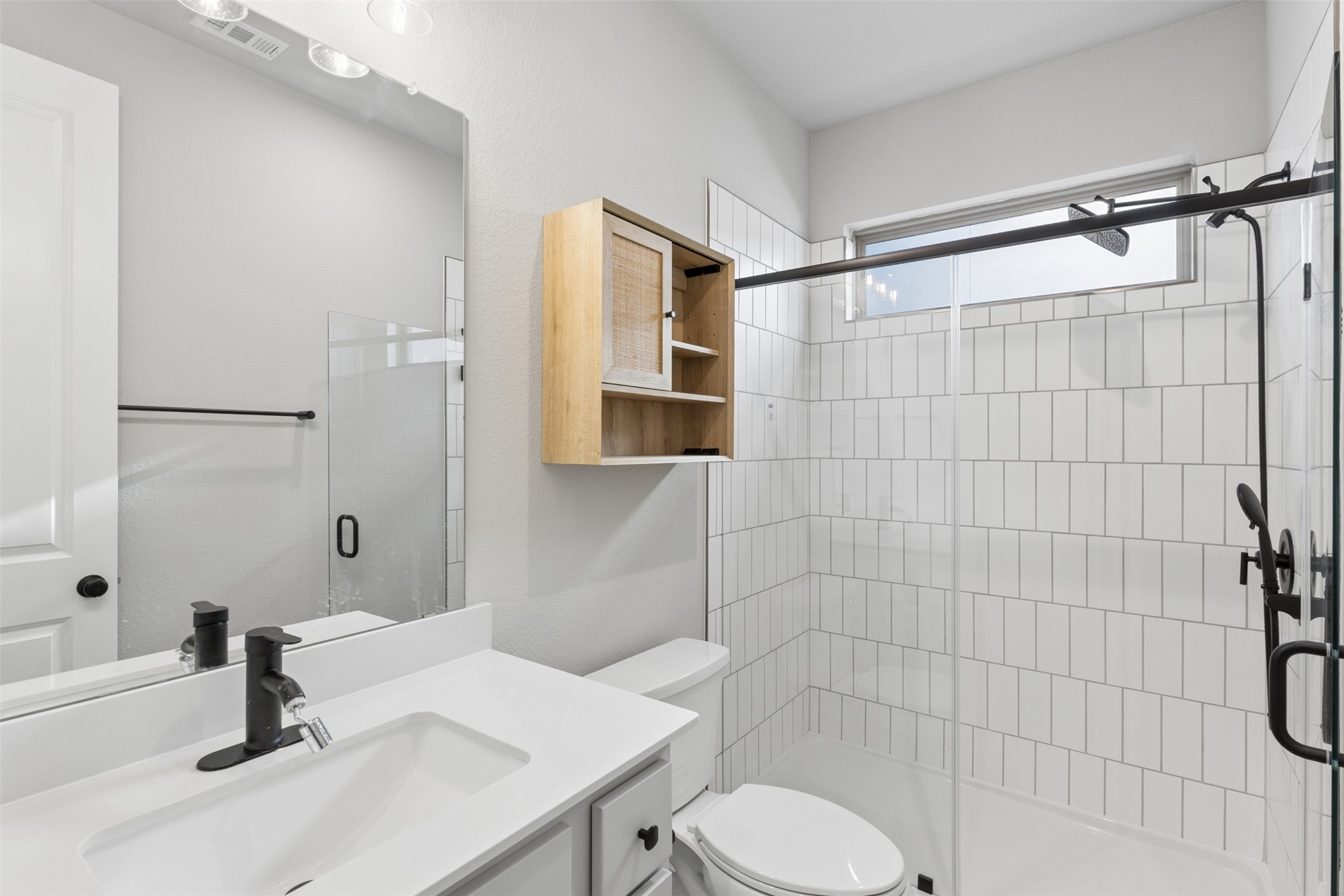 1508 Cardinal Lane Round Rock, TX 78681 - Photo 15 of 35 Full bathroom featuring a shower stall and vanity
