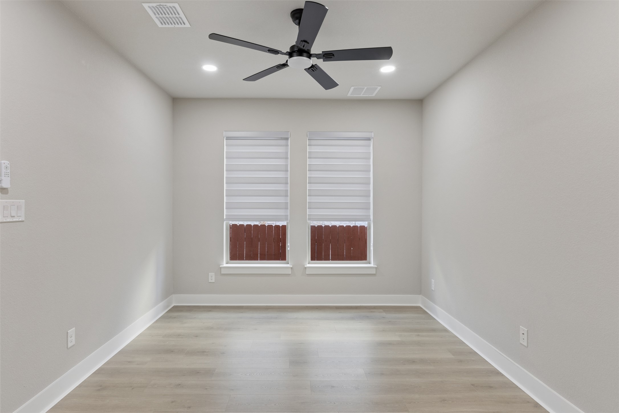 1508 Cardinal Lane Round Rock, TX 78681 - Photo 16 of 35 Spare room featuring ceiling fan, light wood-type flooring, and recessed lighting