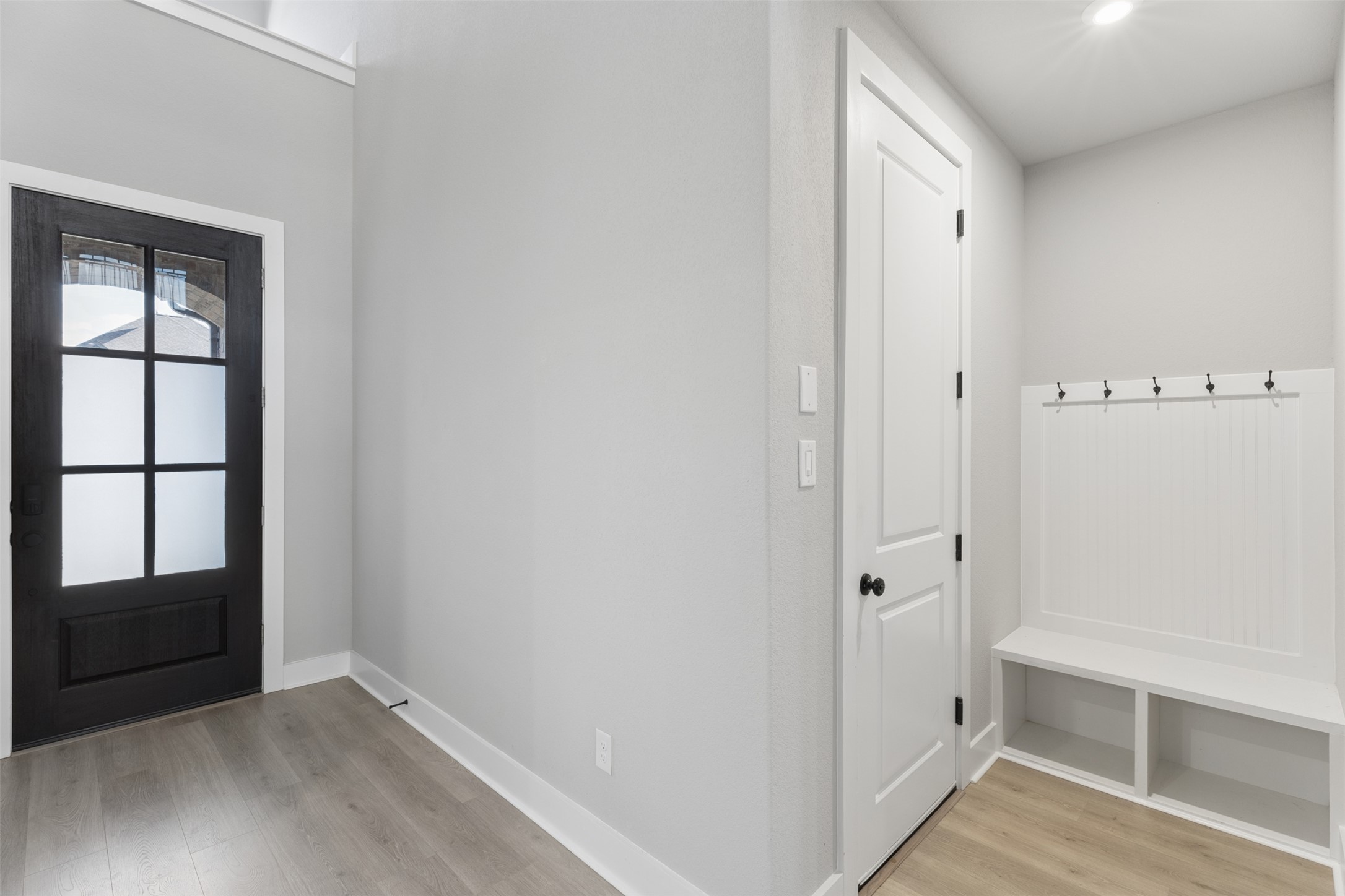1508 Cardinal Lane Round Rock, TX 78681 - Photo 2 of 35 Mudroom with light wood finished floors and baseboards