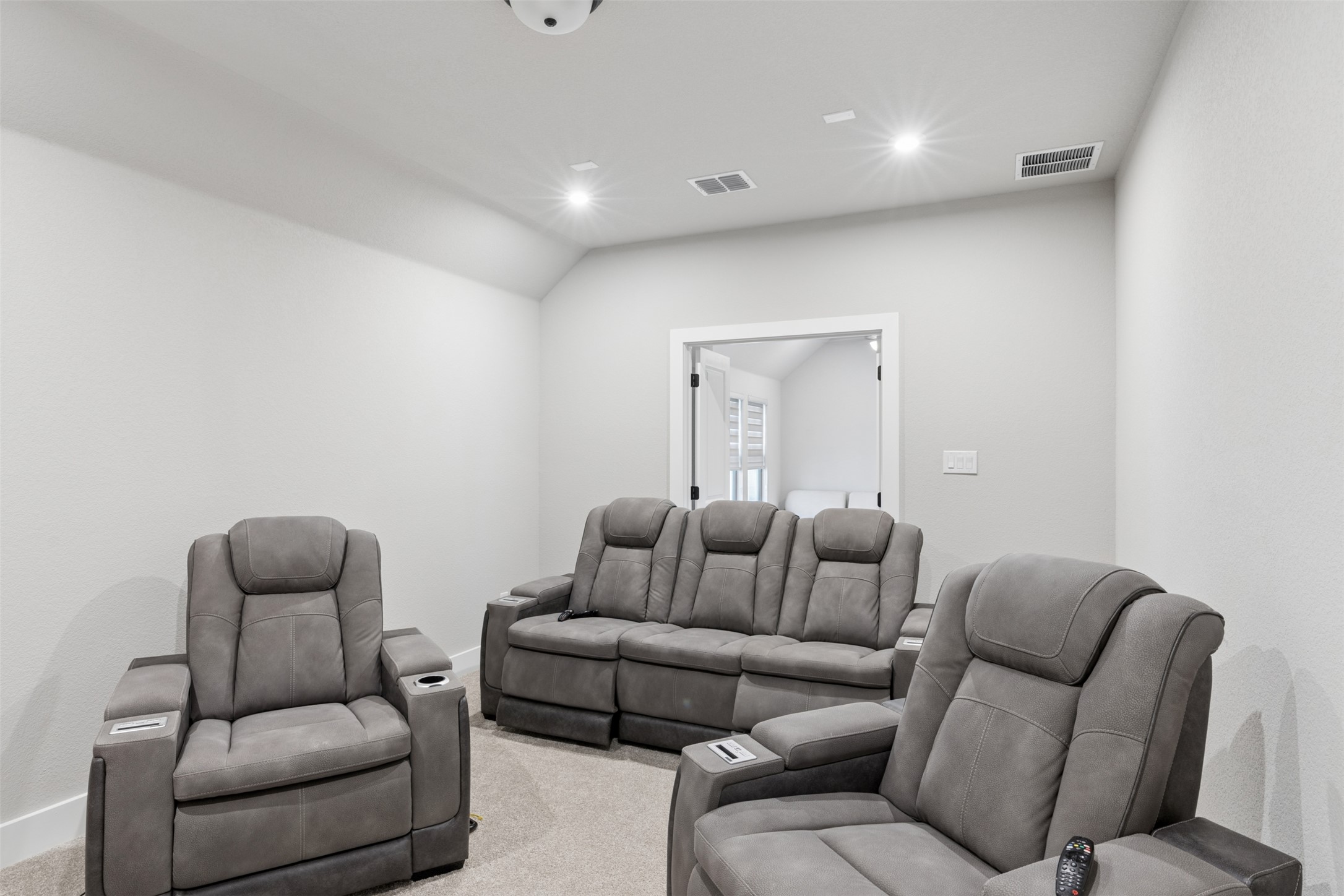 1508 Cardinal Lane Round Rock, TX 78681 - Photo 28 of 35 Cinema room featuring recessed lighting, carpet floors, and lofted ceiling