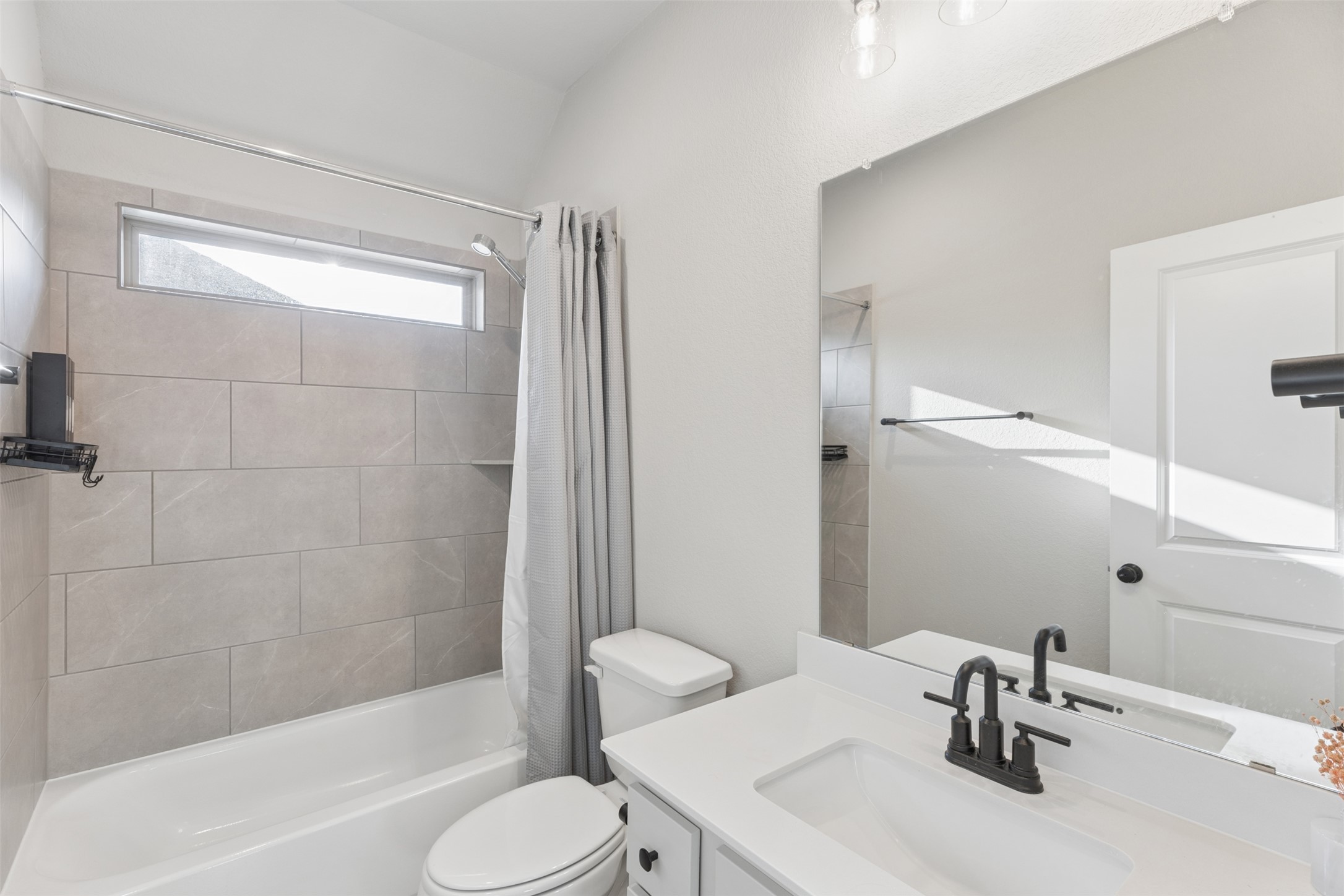 1508 Cardinal Lane Round Rock, TX 78681 - Photo 32 of 35 Full bath with vanity and shower / tub combo with curtain