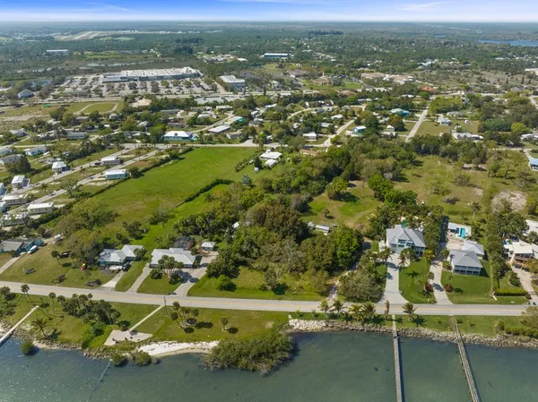 an aerial view of a houses with a yard