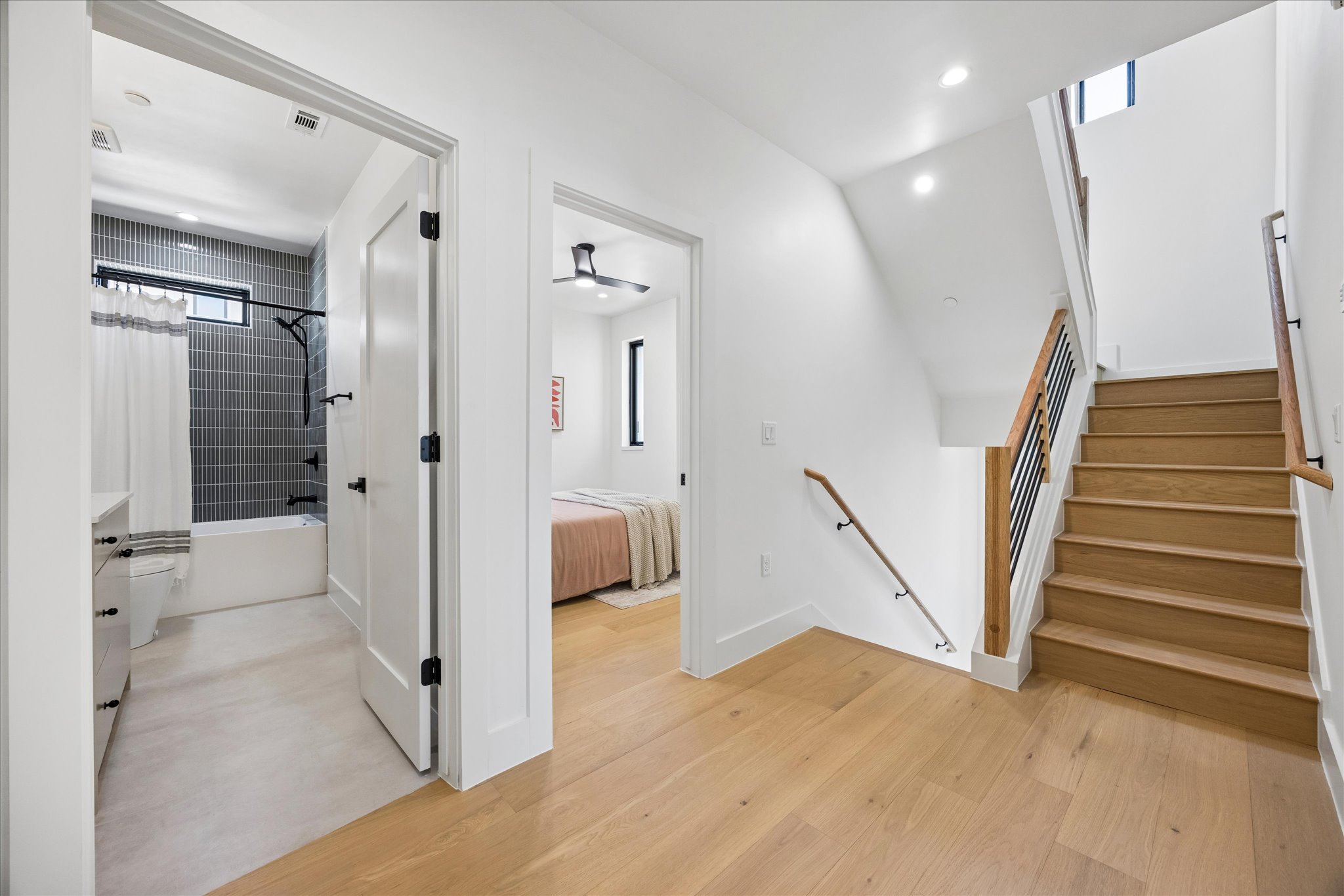 4416 South 1st Street, Unit 2 Austin, TX 78745 - Photo 13 of 33 a view of a hallway with wooden floor and staircase