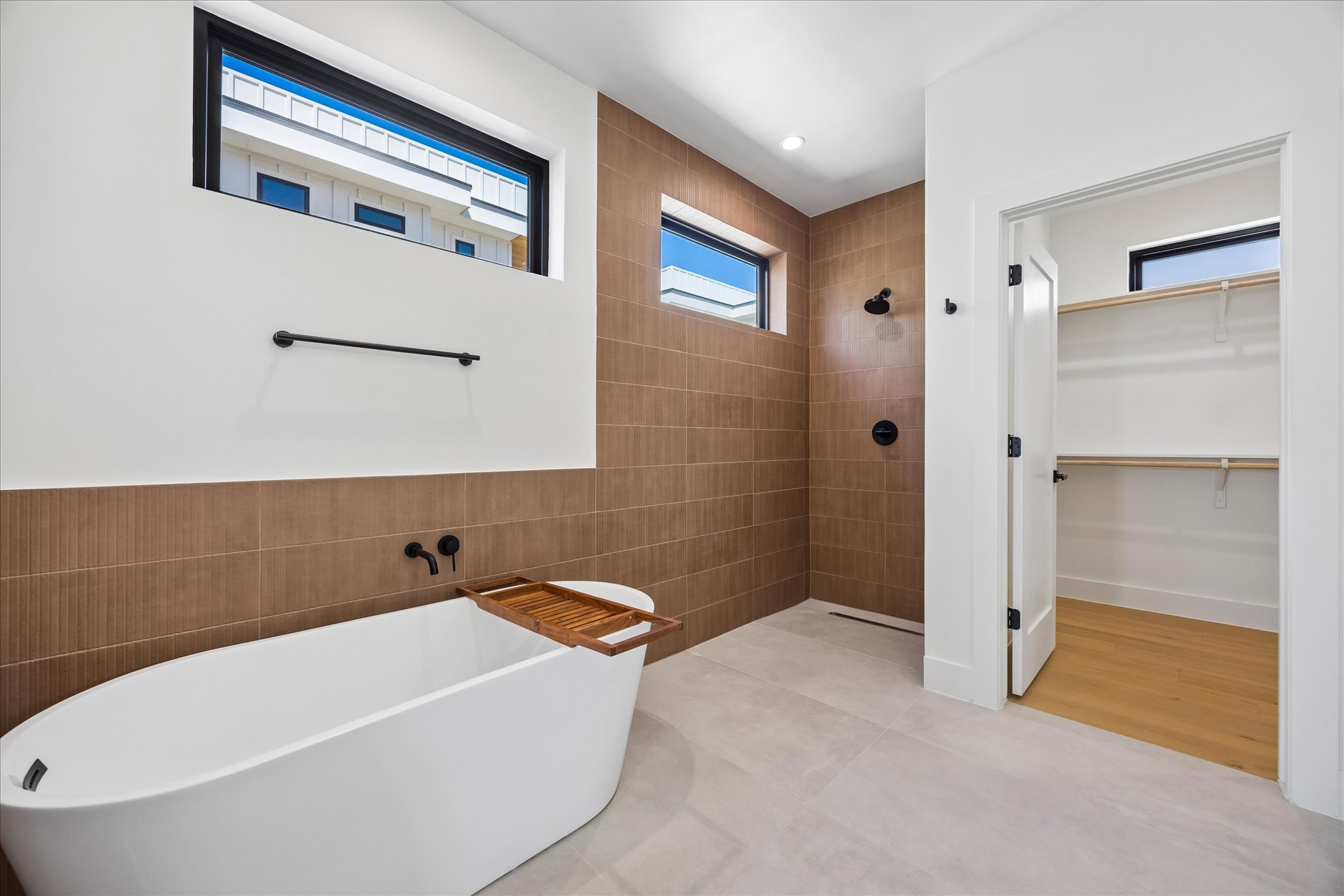 4416 South 1st Street, Unit 2 Austin, TX 78745 - Photo 18 of 33 a bathroom with a tub and shower