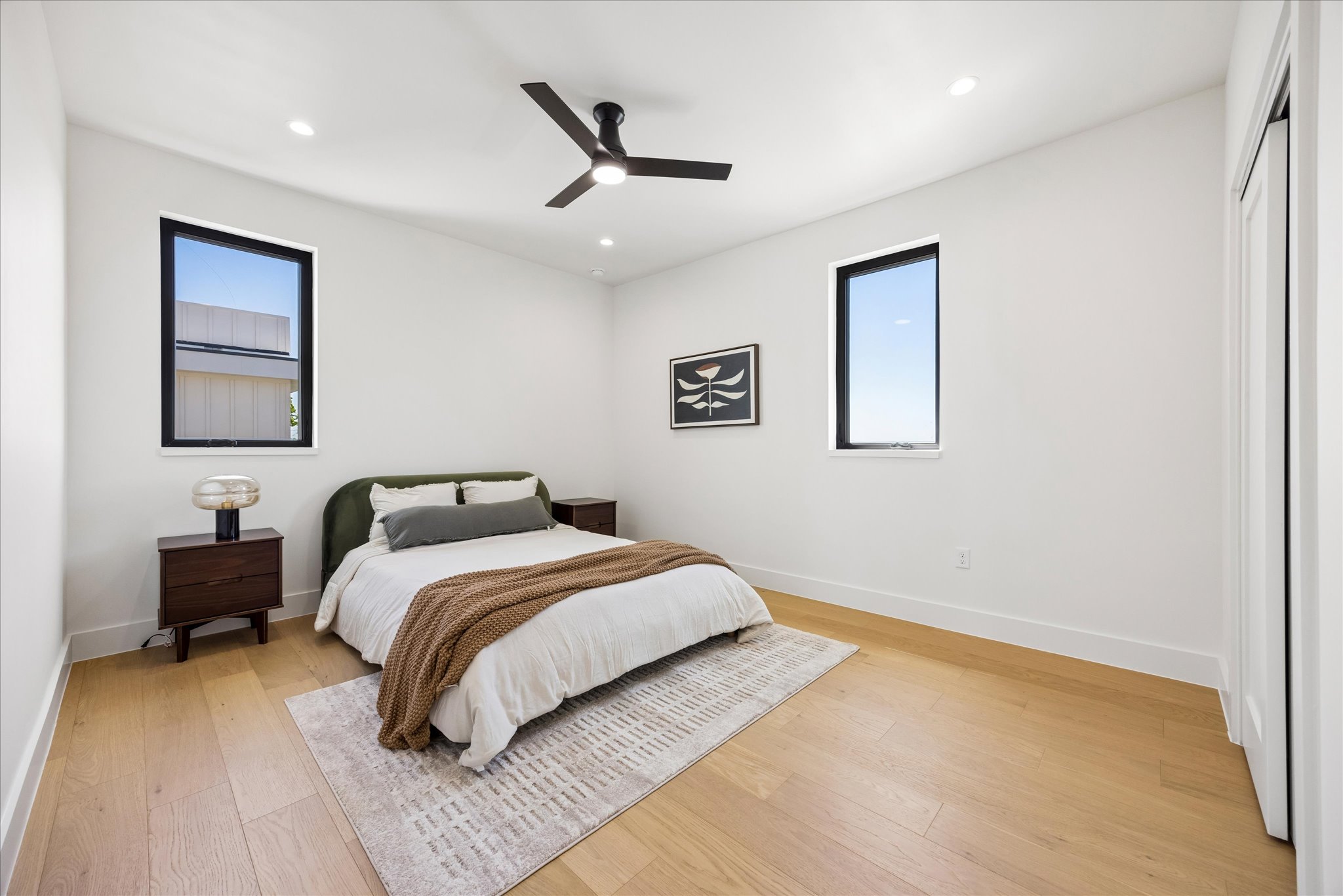 4416 South 1st Street, Unit 2 Austin, TX 78745 - Photo 20 of 33 a bedroom with a large bed and a chandelier