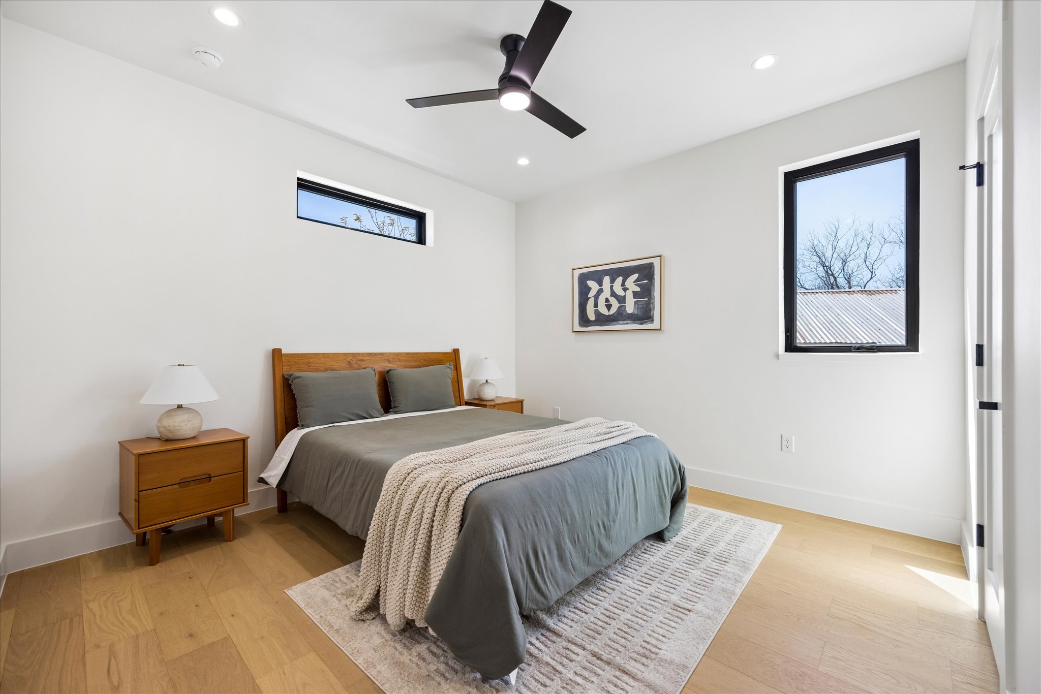 4416 South 1st Street, Unit 2 Austin, TX 78745 - Photo 21 of 33 a bedroom with bed and painting on the wall