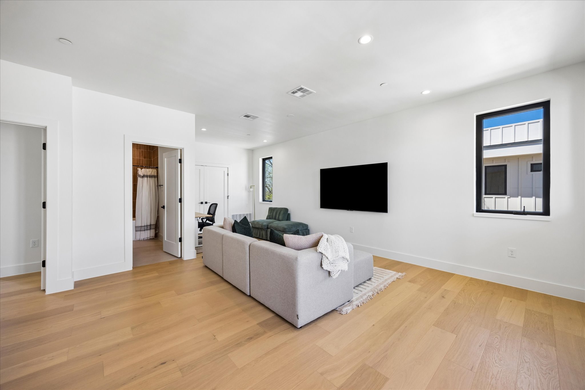 4416 South 1st Street, Unit 2 Austin, TX 78745 - Photo 26 of 33 a living room with furniture and a flat screen tv
