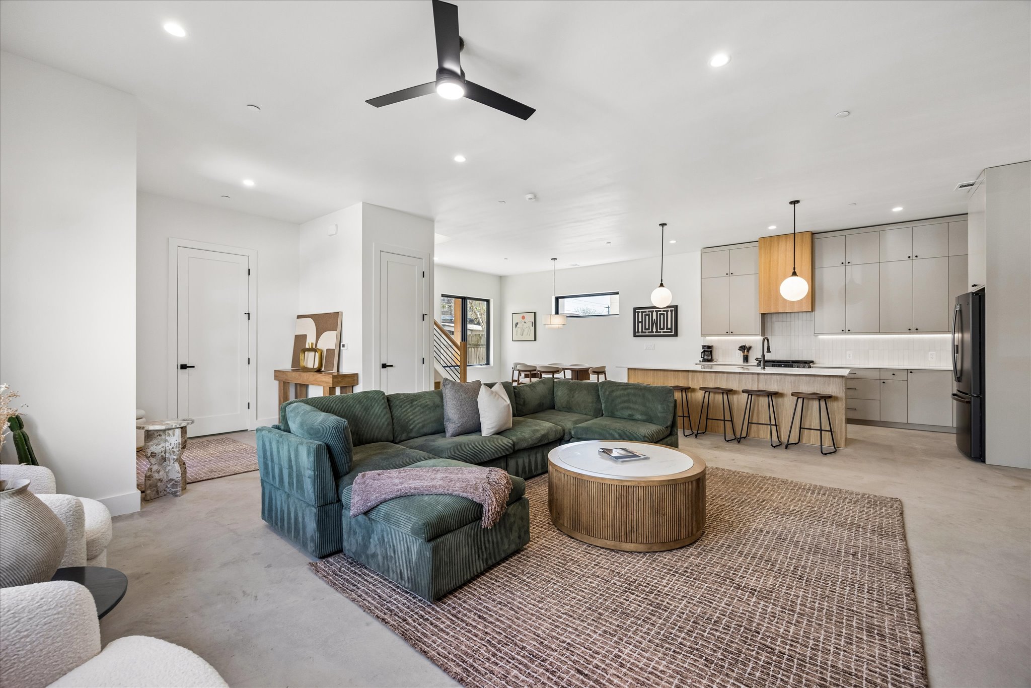 4416 South 1st Street, Unit 2 Austin, TX 78745 - Photo 3 of 33 a living room kitchen with a couch and a view of kitchen