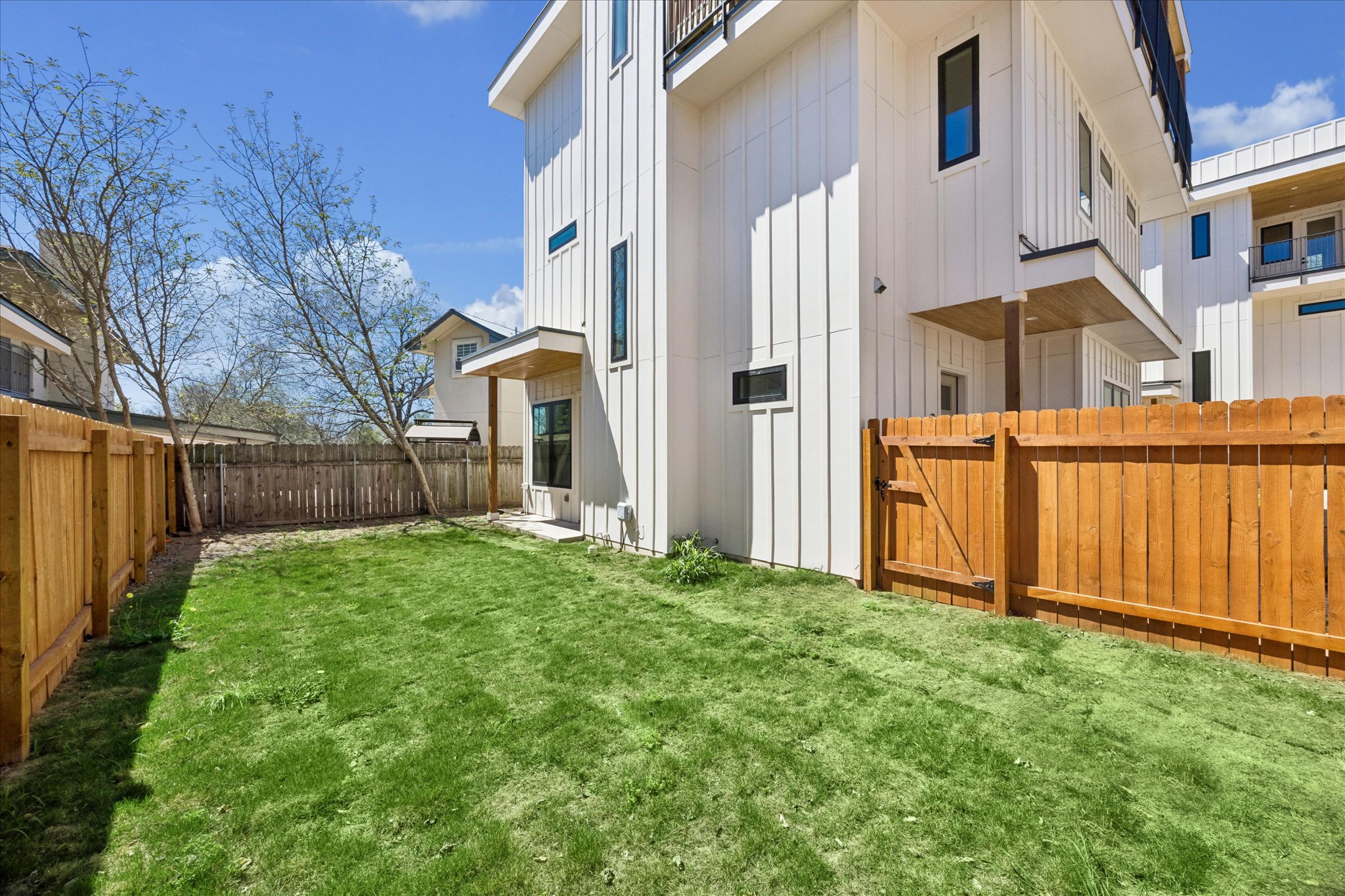 4416 South 1st Street, Unit 2 Austin, TX 78745 - Photo 33 of 33 a view of a front of a house with a yard and wooden fence