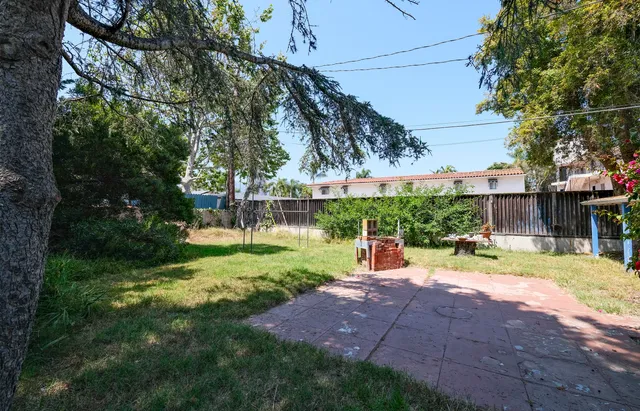 a view of a backyard with a garden and plants