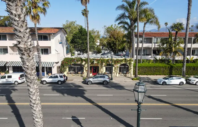 a view of a street with cars
